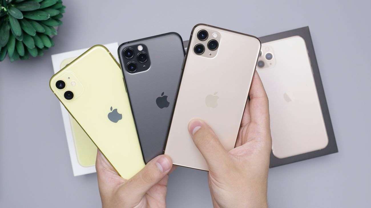 All iPhone models hold by hand with clean background