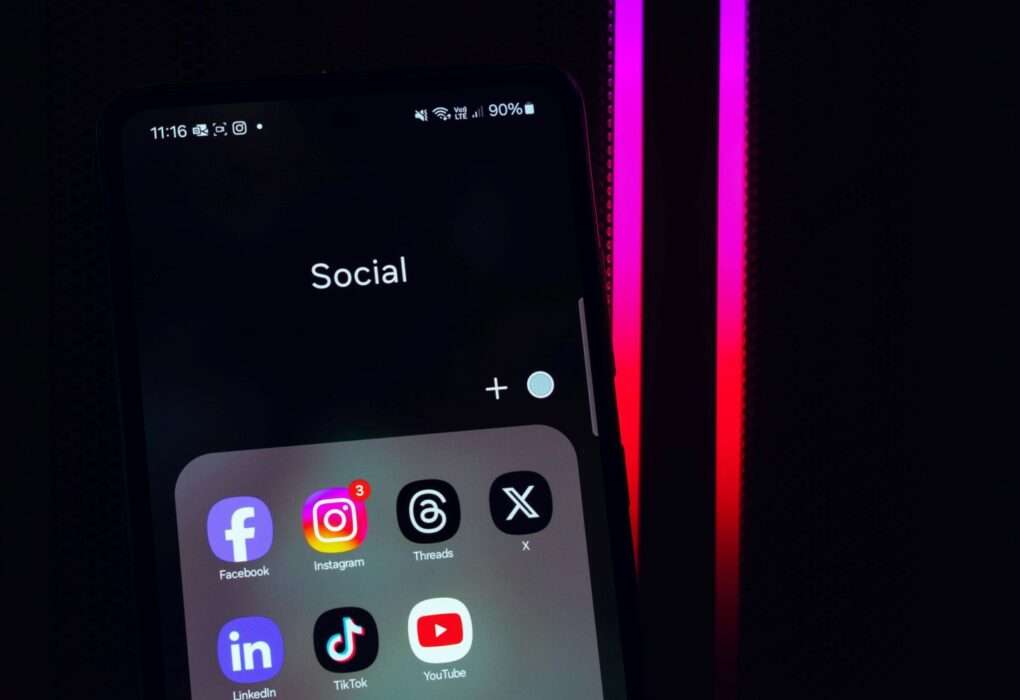 dark background and social media icons on smartphone