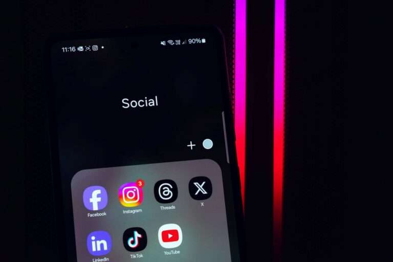 dark background and social media icons on smartphone